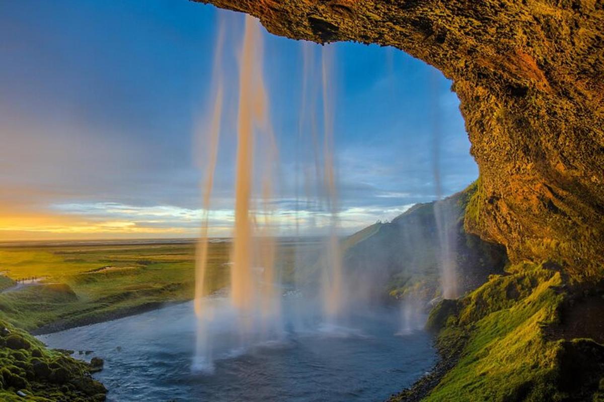 a view of a waterfall from a rock formation