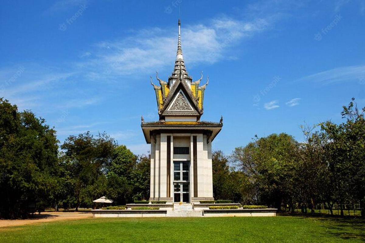 a clock tower in a park with a sky