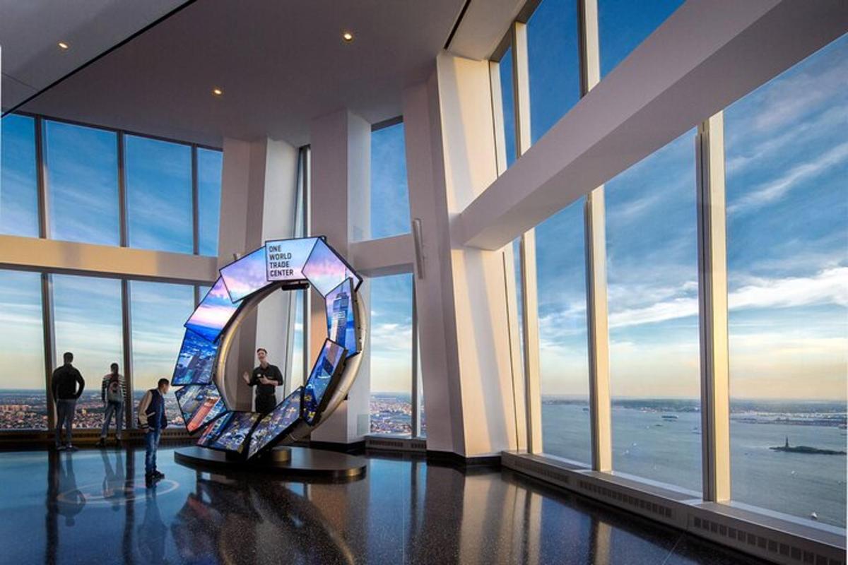 a room with a large mirror in a building with windows