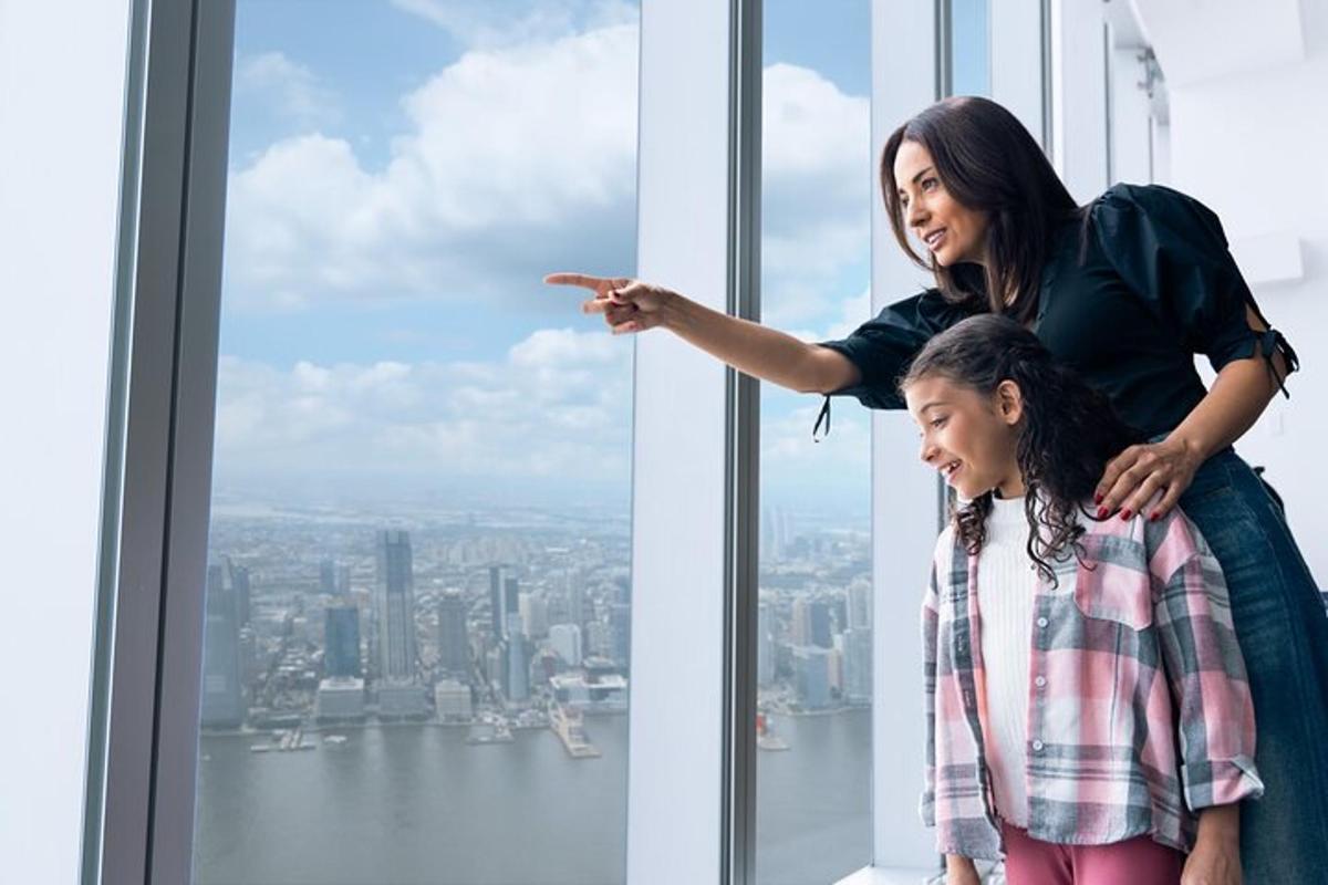 a woman pointing at a window in a skyscraper