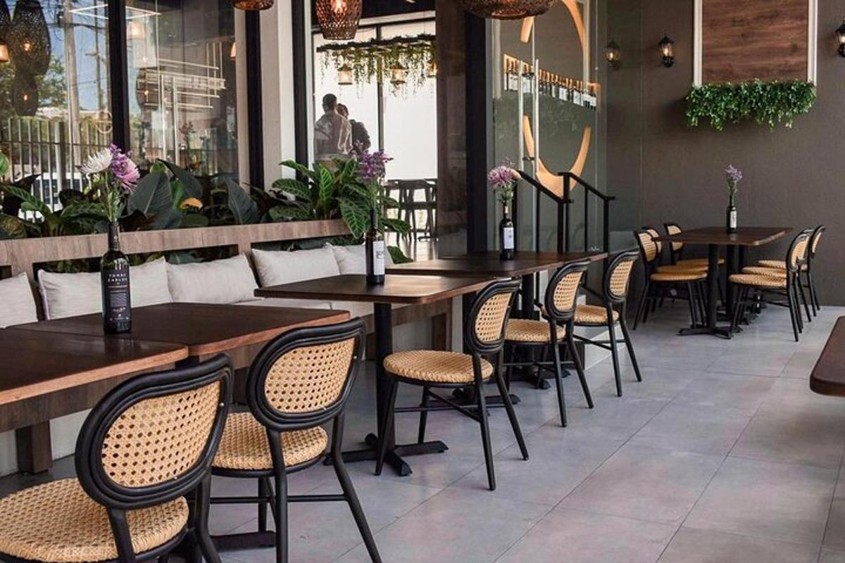 a row of tables and chairs in a restaurant