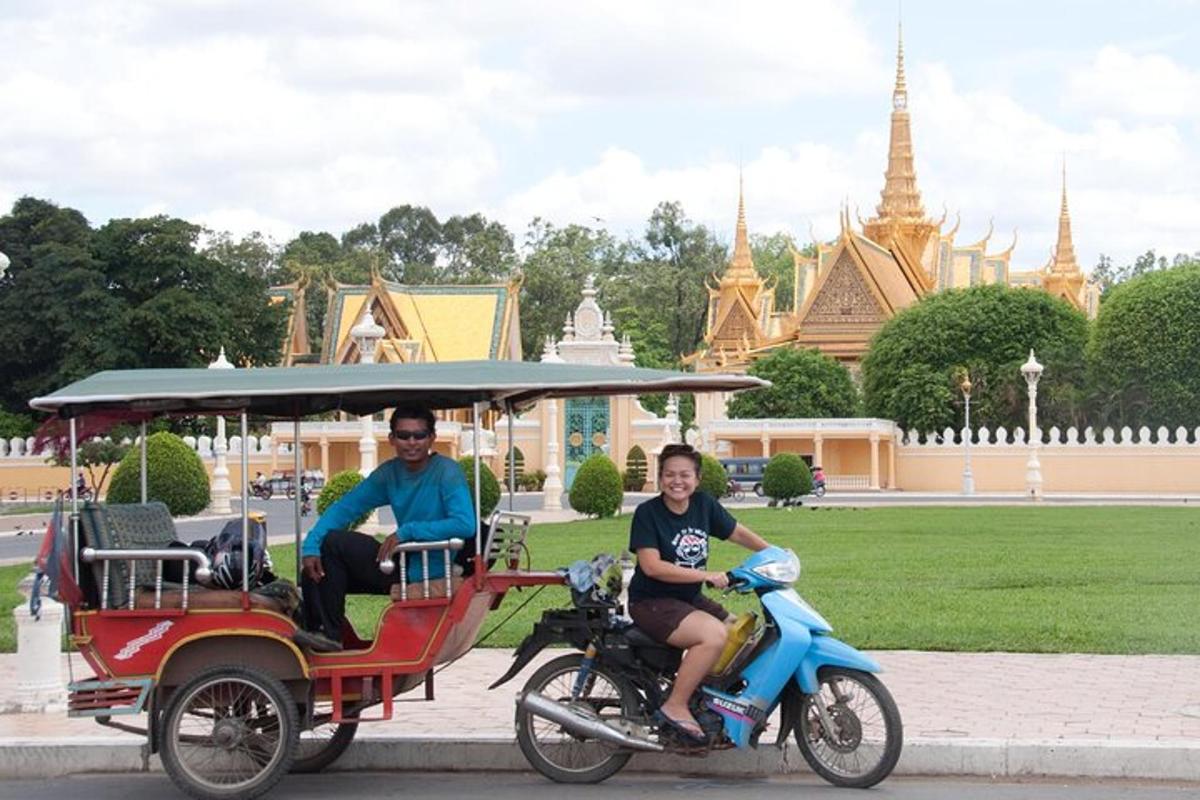 a man and a woman riding a golf cart