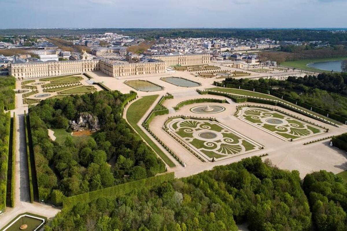 an aerial view of the palace of versailles with a park