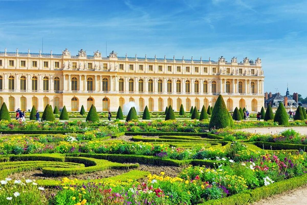 a large building with a garden in front of it