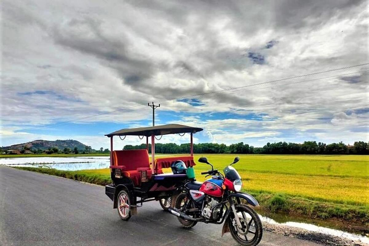 a motorcycle with a golf cart on a road