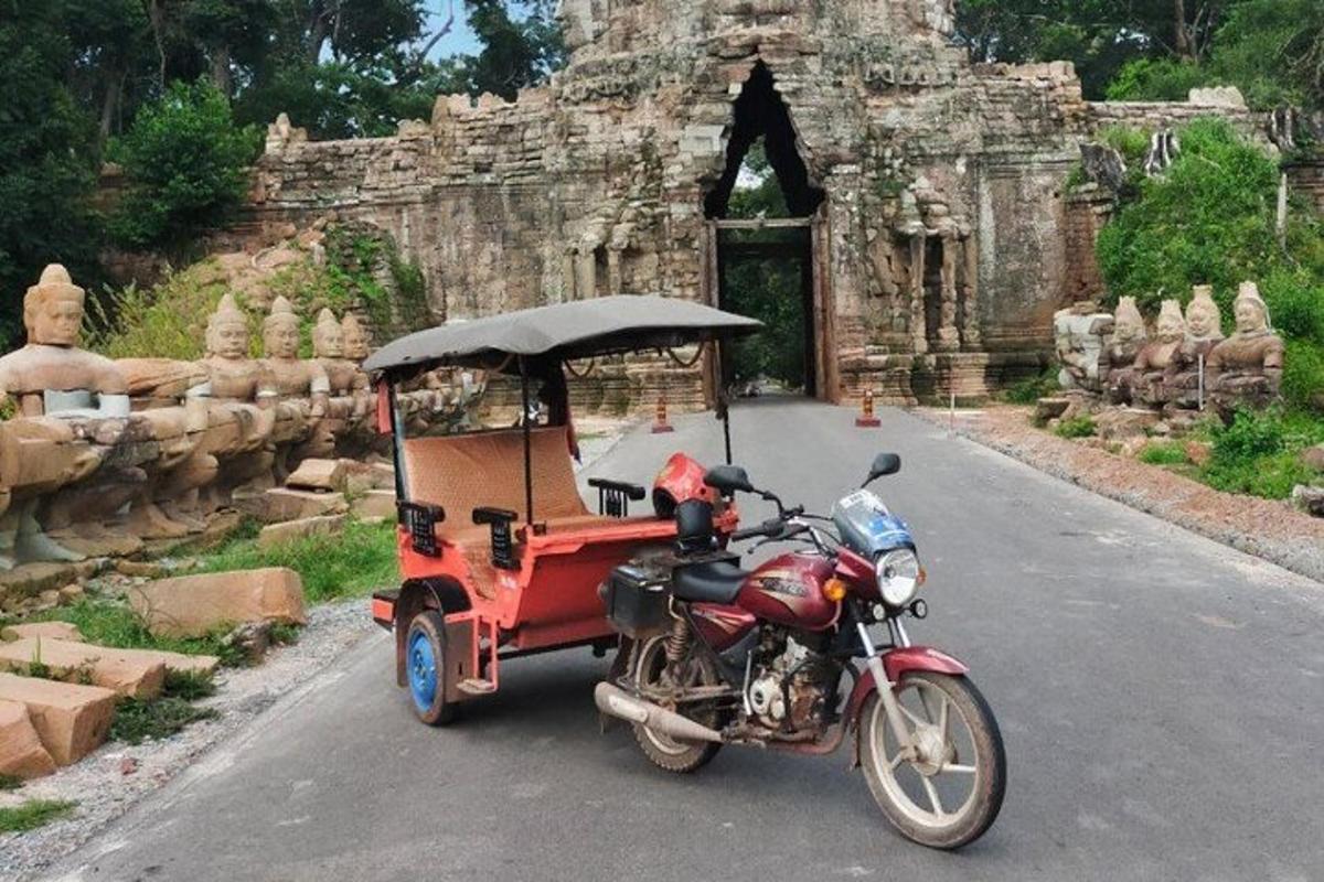 a motorcycle with a cart on the road