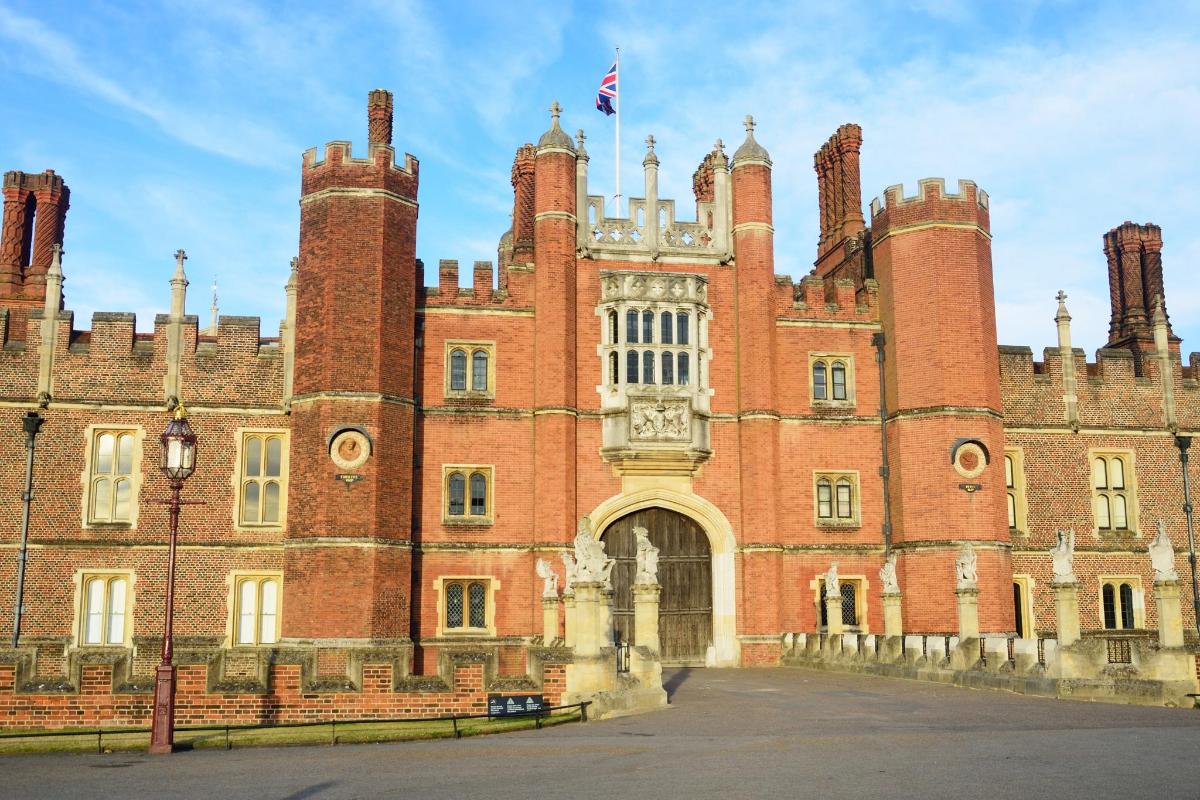 an old castle with a flag on top of it