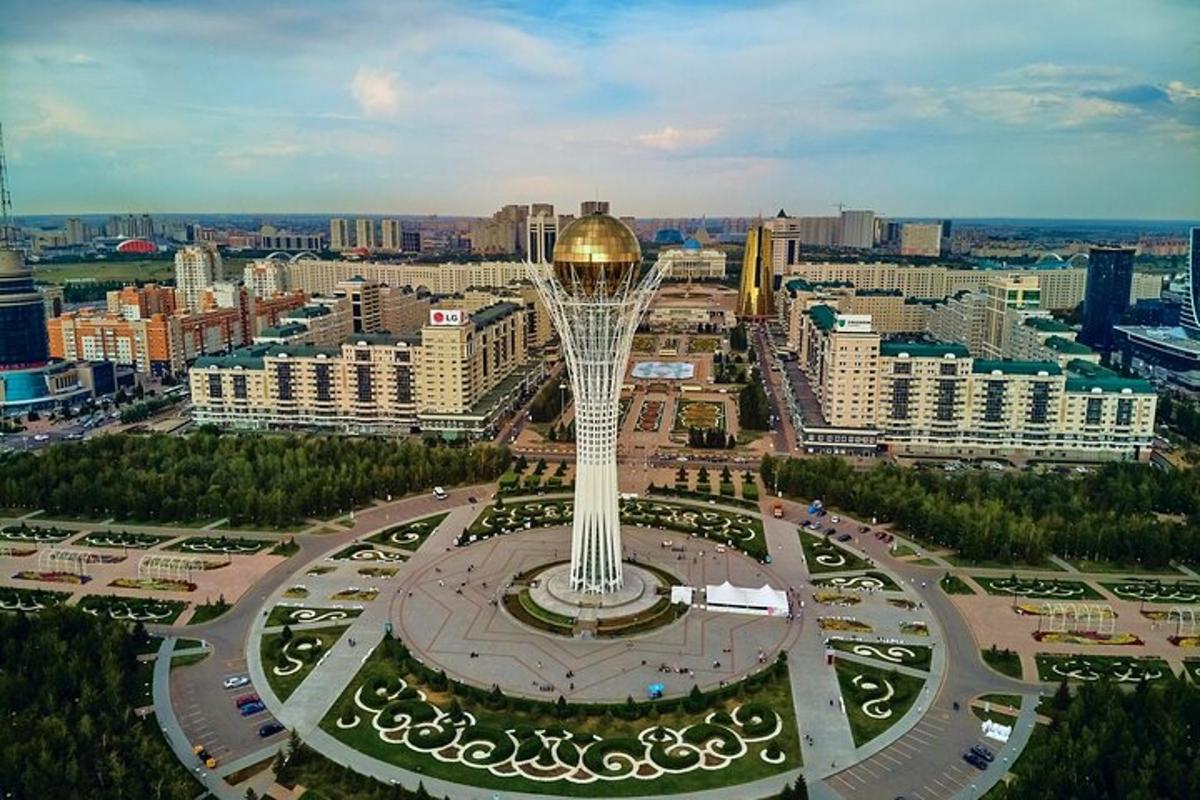 an aerial view of a city with a large tower