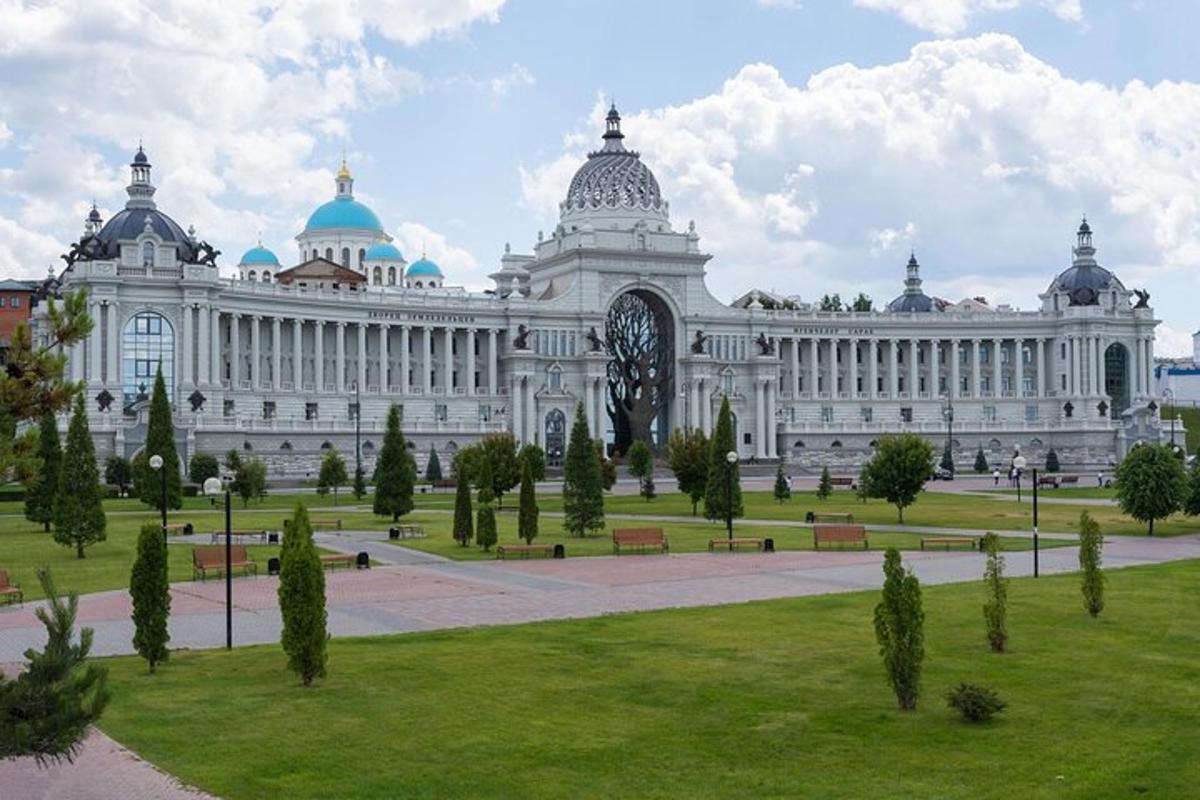 a large building with a park in front of it