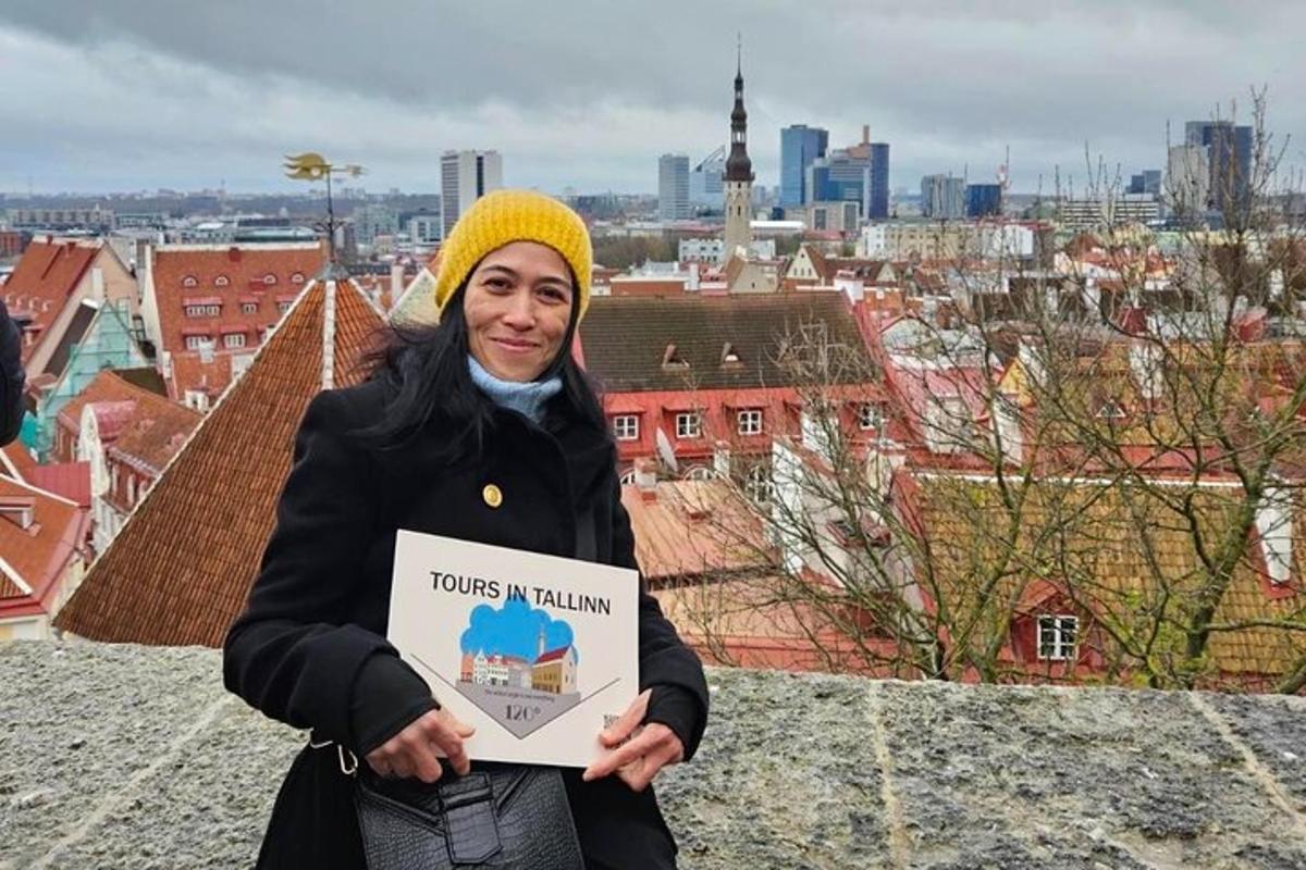 a woman holding a sign in front of a city