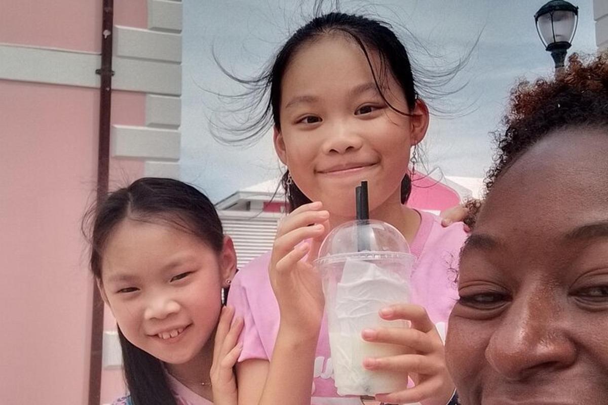 two girls are holding a glass of milk