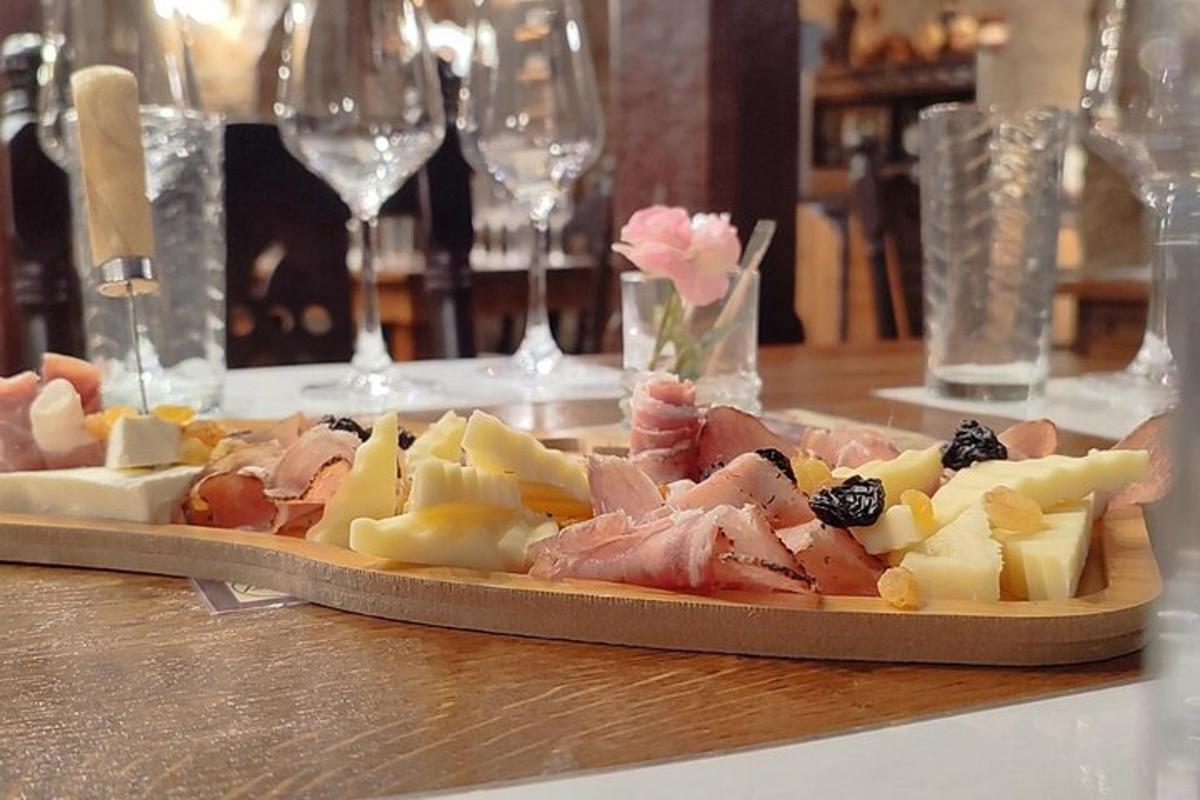 a plate of food on a table with wine glasses