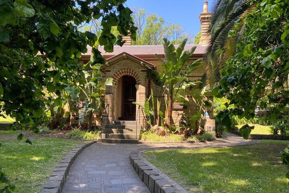 a brick house with a walkway in front of it