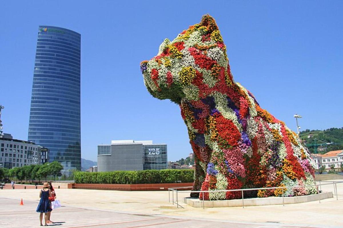 a statue of a dog made out of flowers