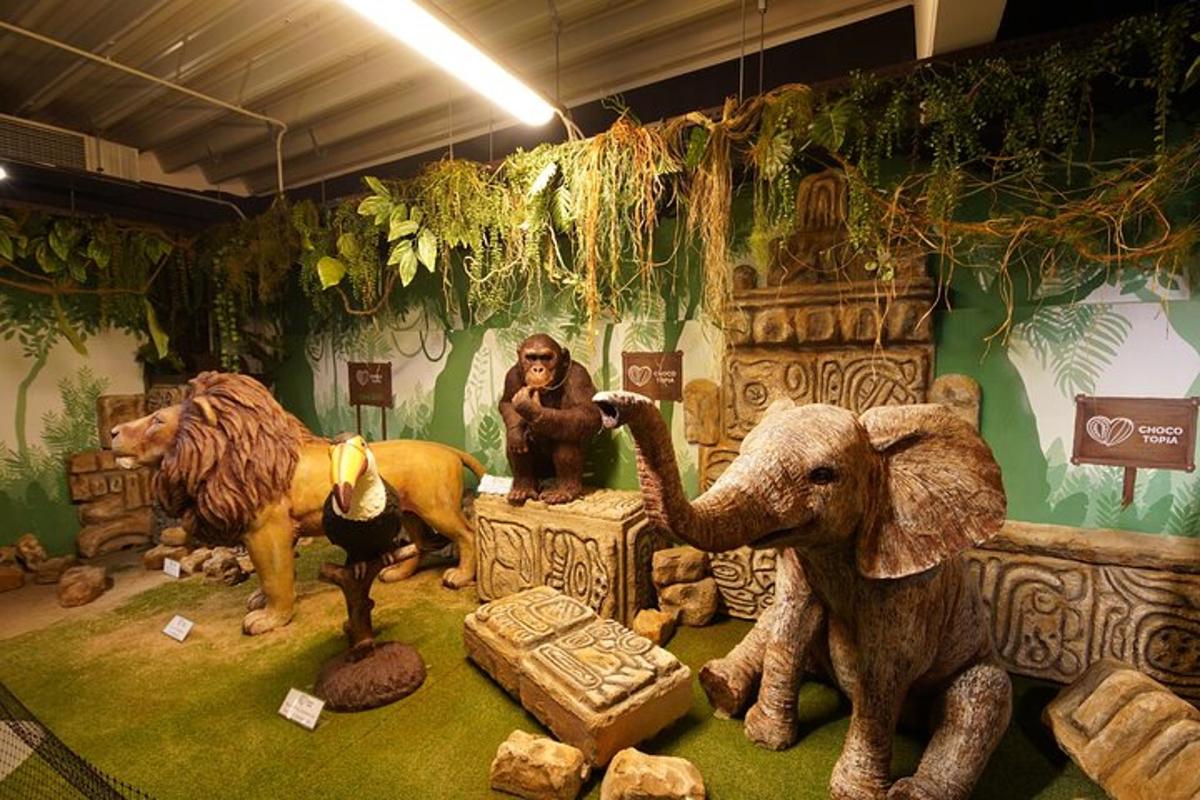a group of statues of animals in a room