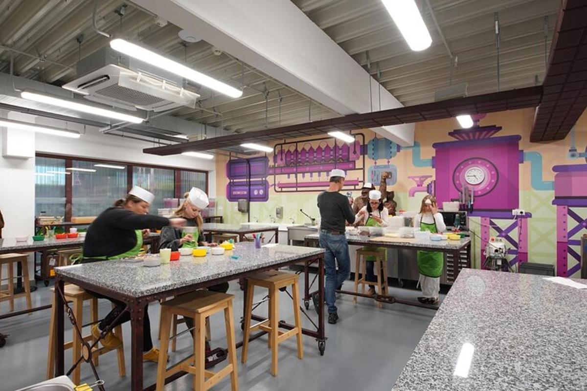 a group of people in a kitchen preparing food