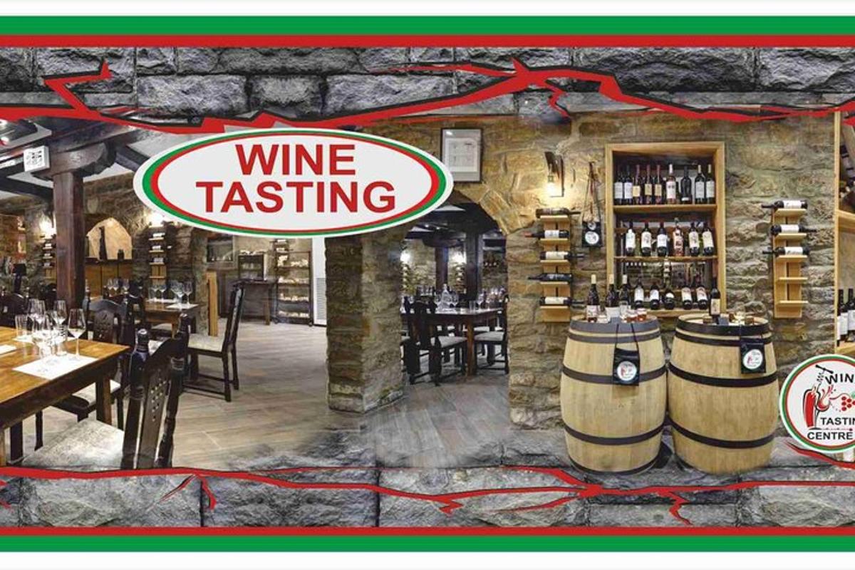 a restaurant with a wine tasting sign on the wall