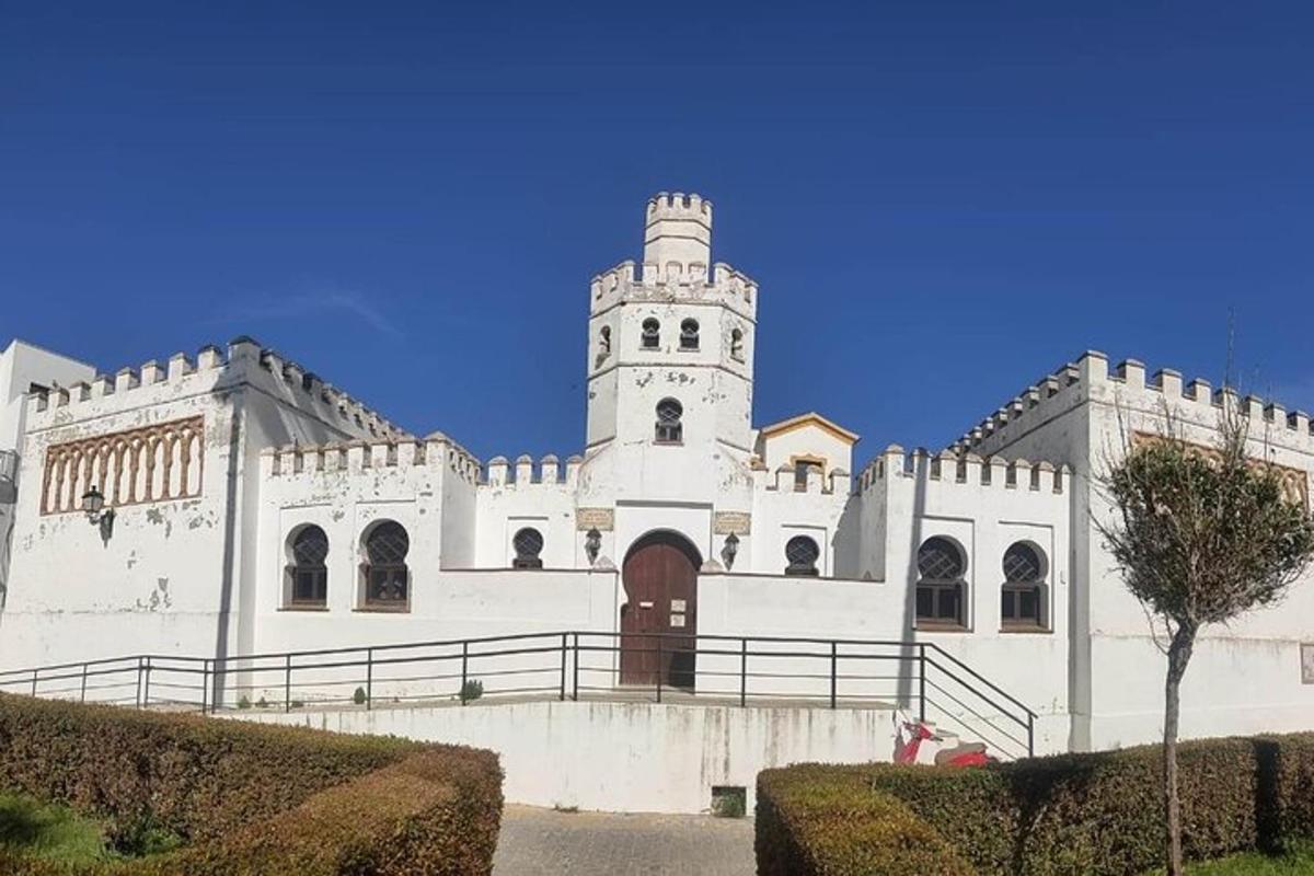 a white building with a tower on top of it