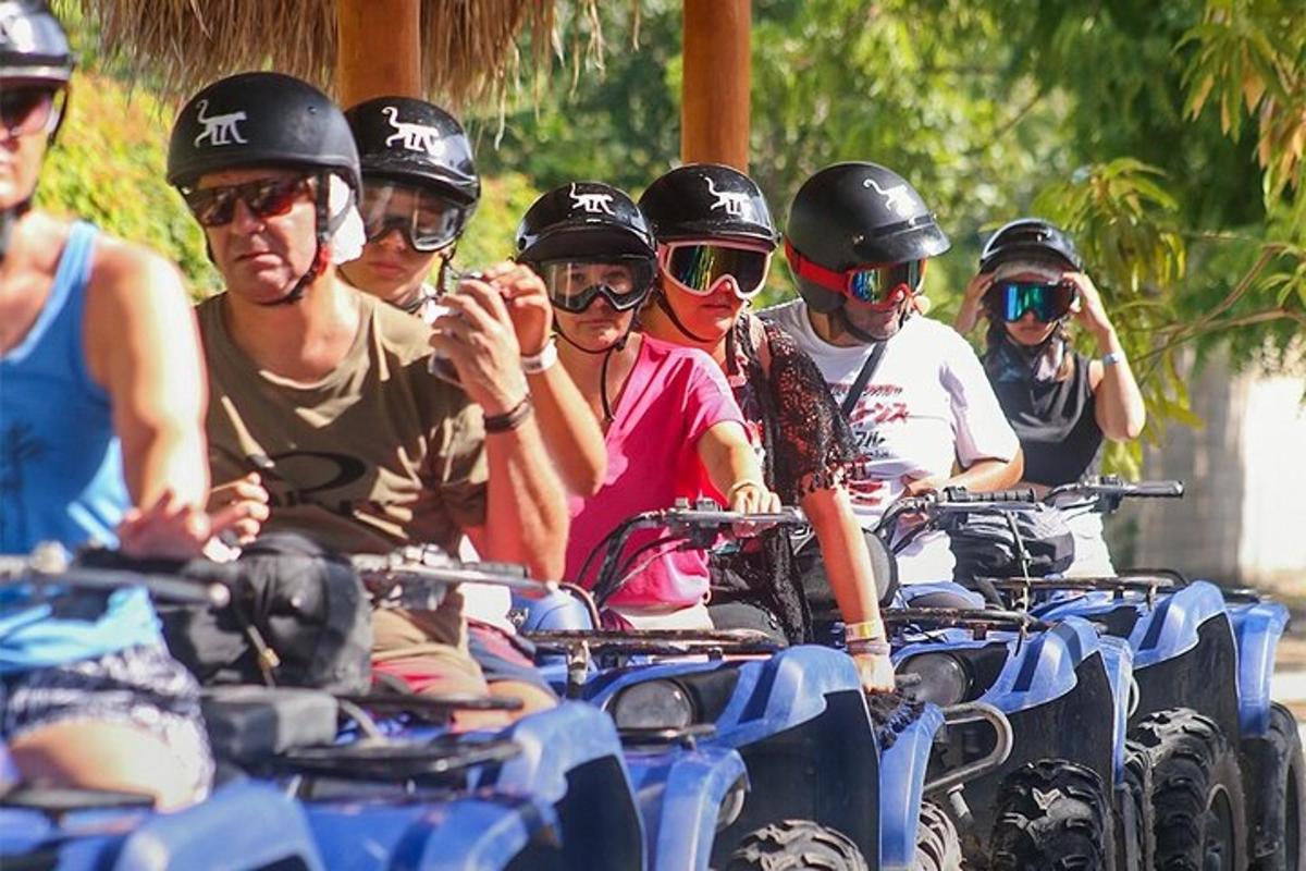 a group of people wearing helmets riding on atvs