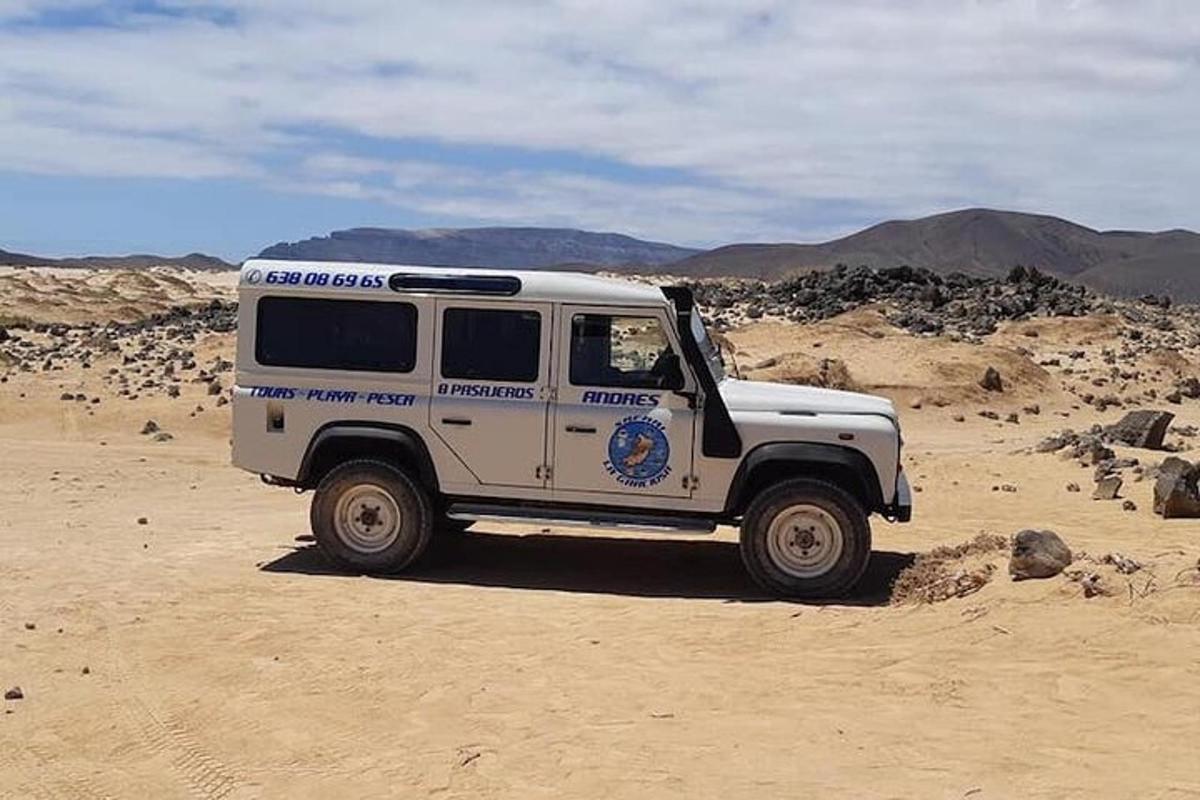 a white truck is parked in the desert