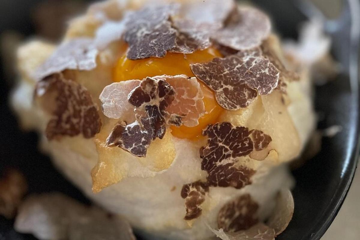 a dessert with an egg and nuts on it