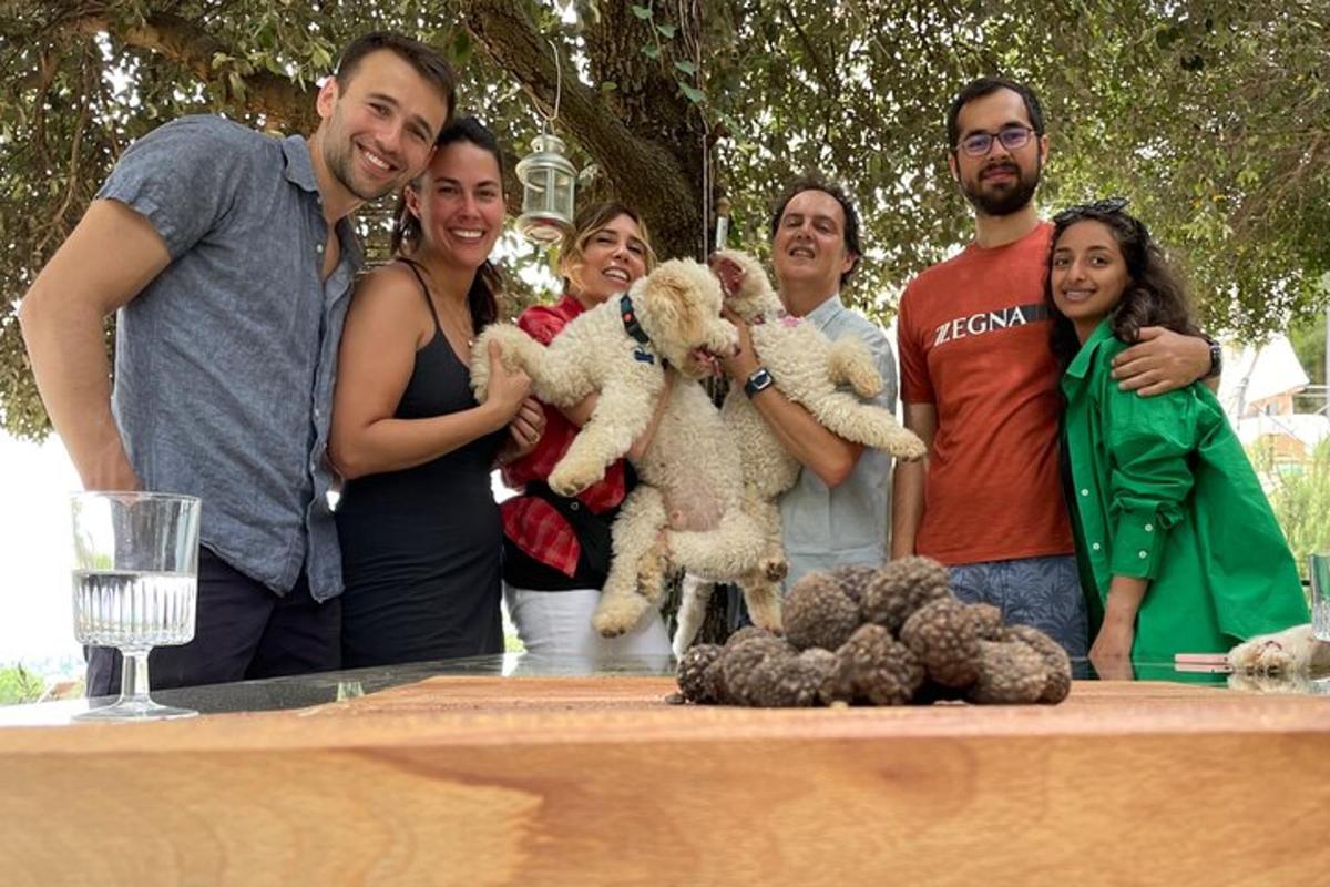 a group of people standing around a table with teddy bears
