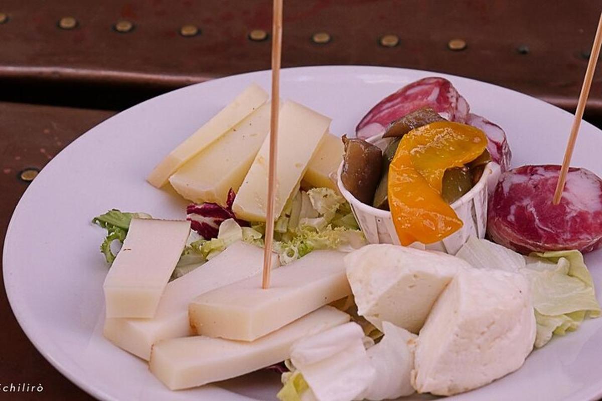 a plate of cheese and fruit on a table