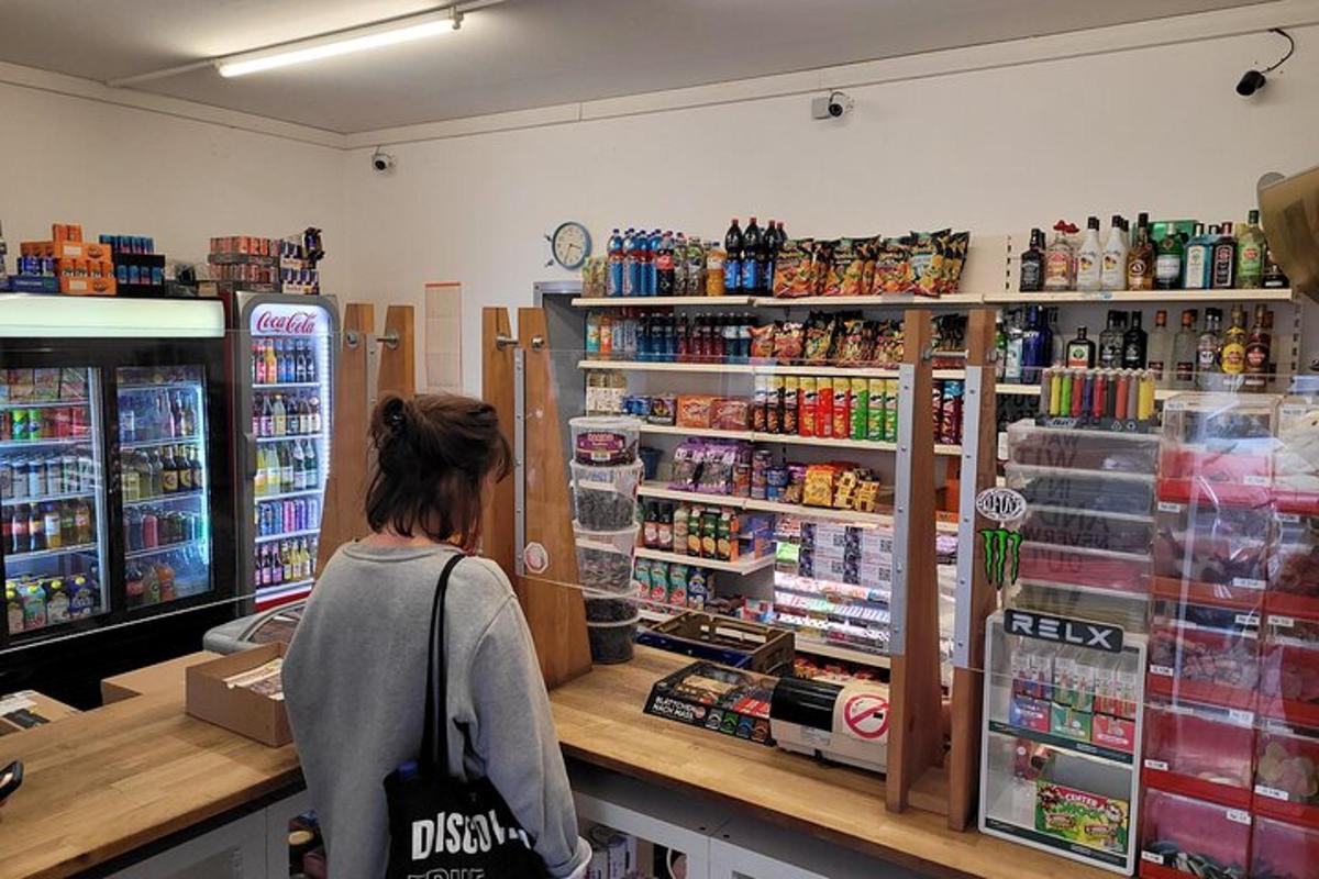 a woman sitting at a counter in a store