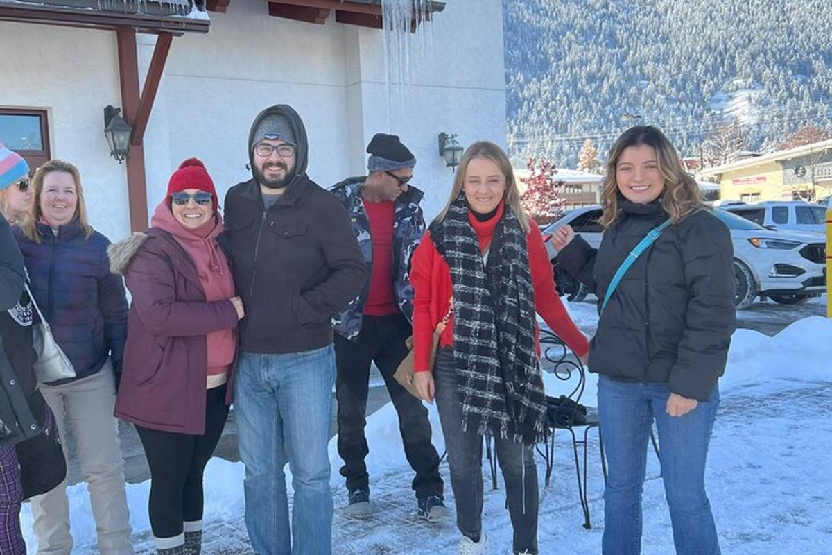 a group of people posing for a picture in the snow
