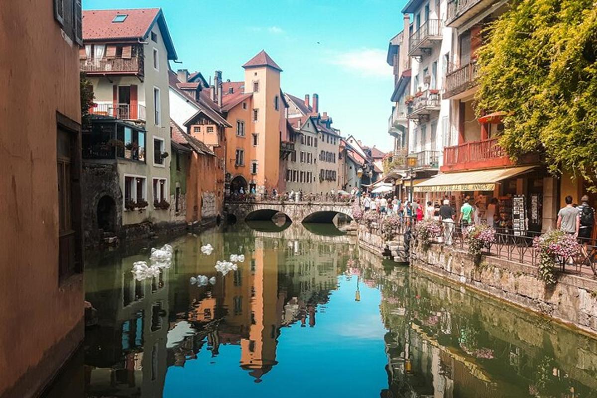 a river in a city with buildings and a bridge