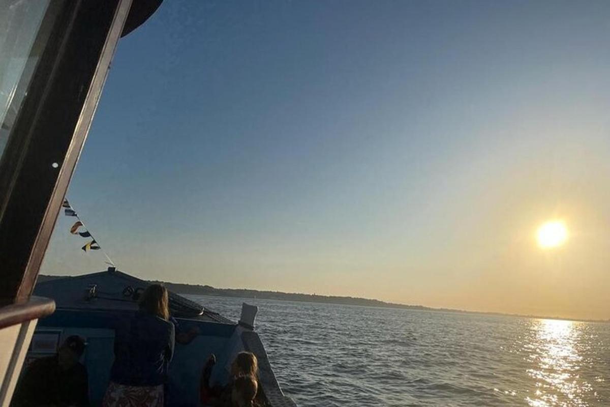 a group of people on a boat in the water