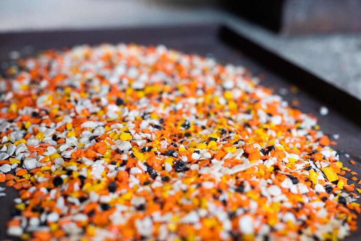a pan full of colorful sprinkles on a table