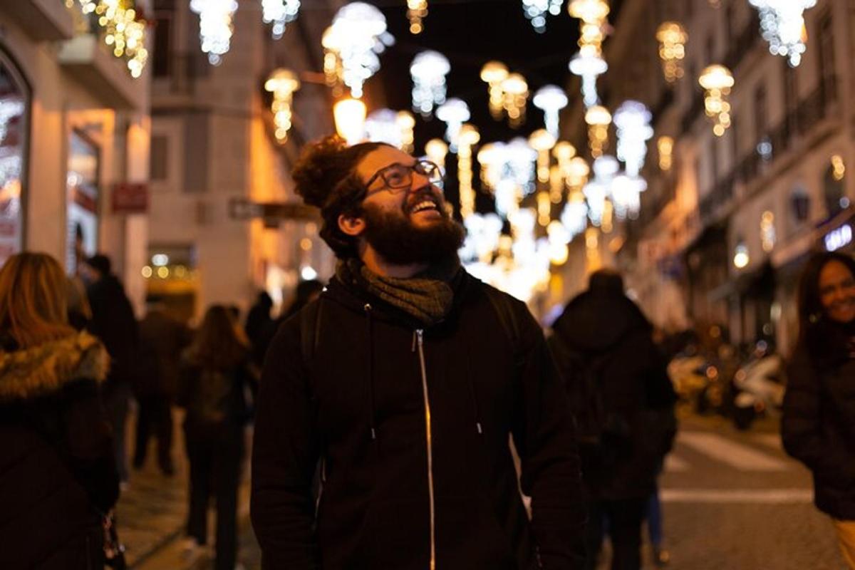 a man standing on a city street at night
