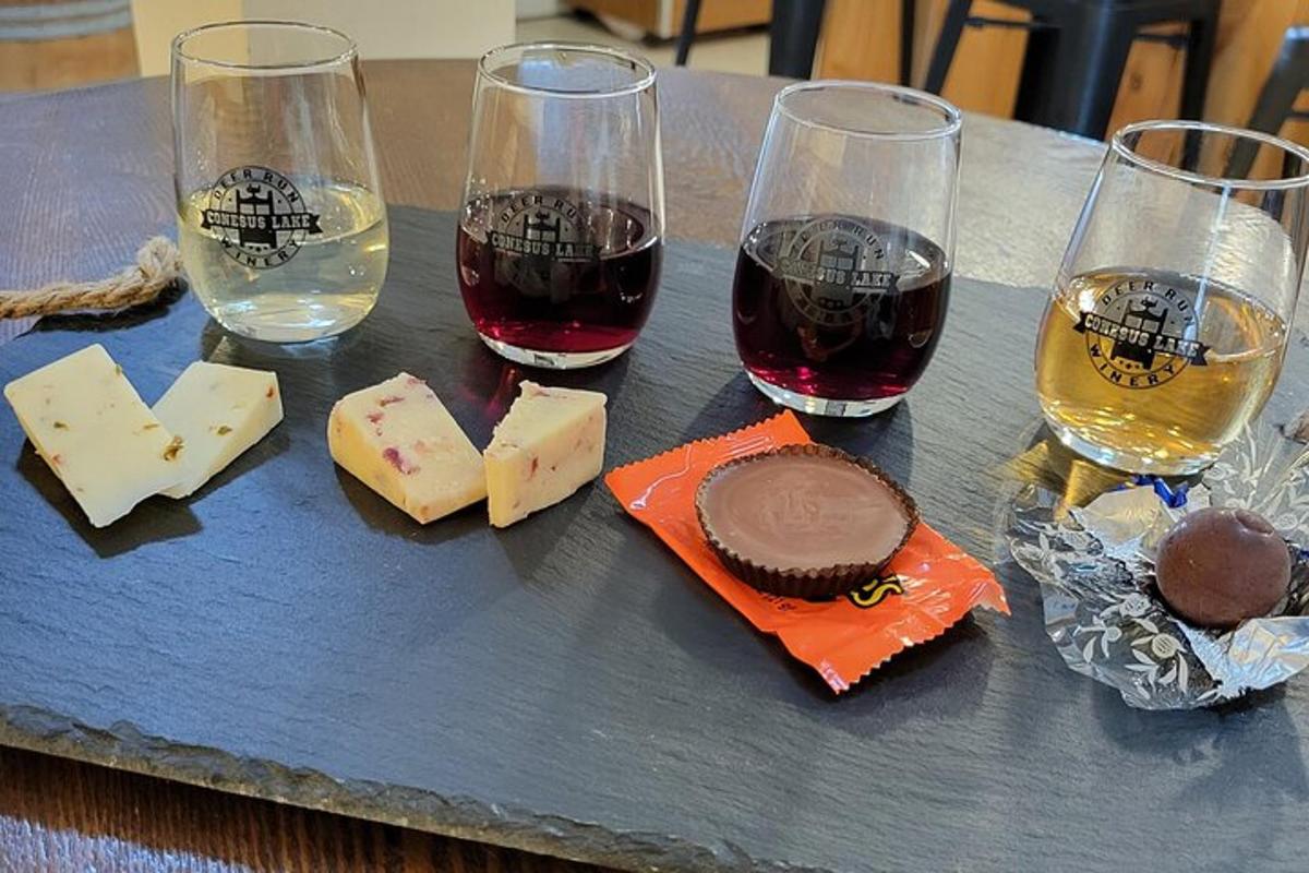 a table topped with glasses of wine and cheese