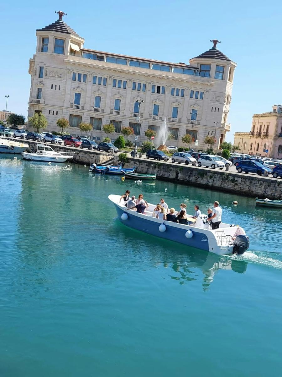a group of people in a boat in the water