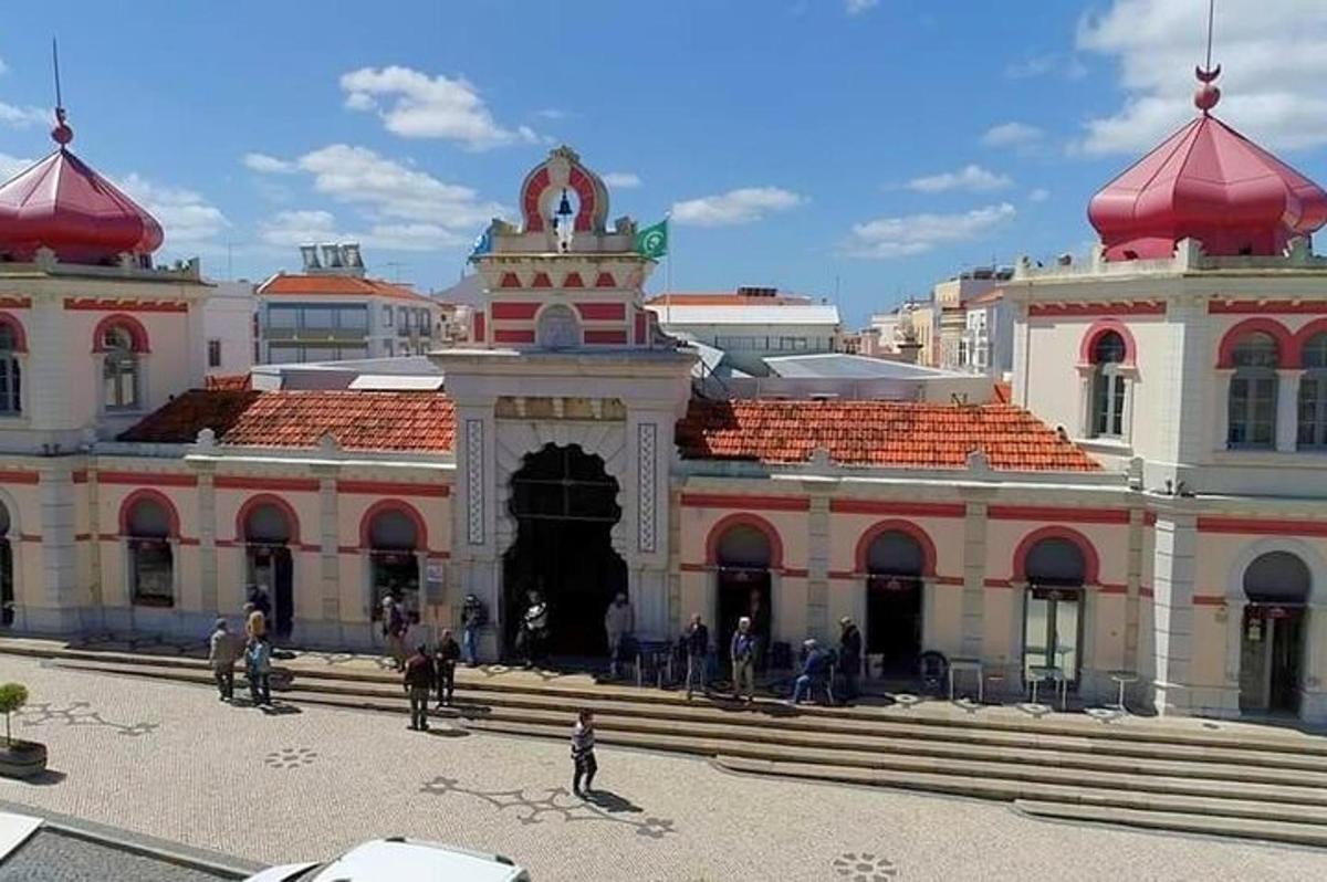 a large building with people standing outside of it