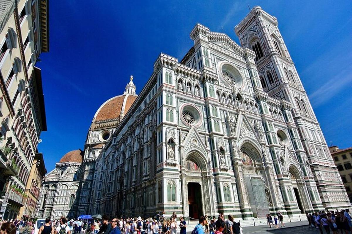 a large building with people walking in front of it