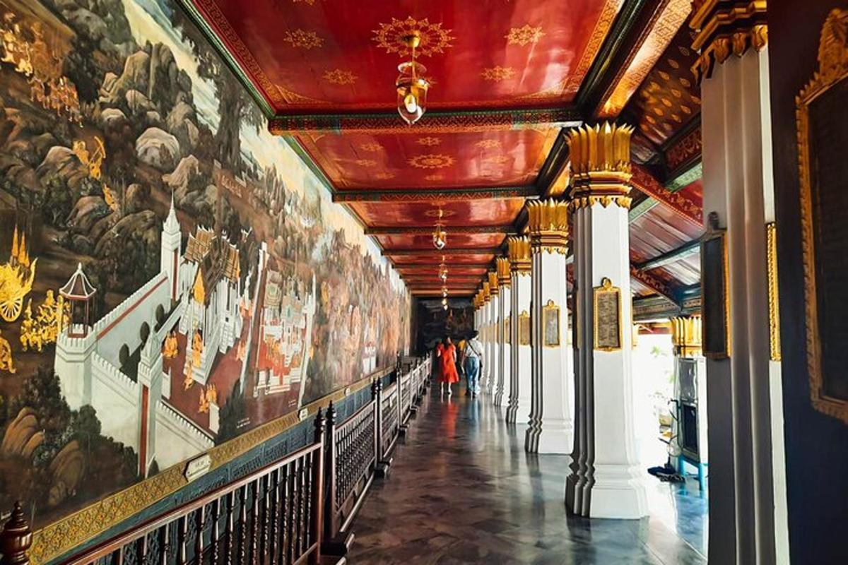 a hallway in a building with paintings on the walls