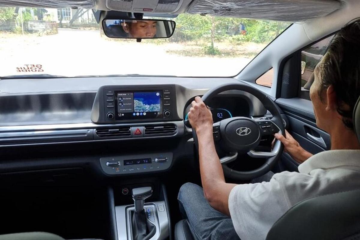 a man driving a car with