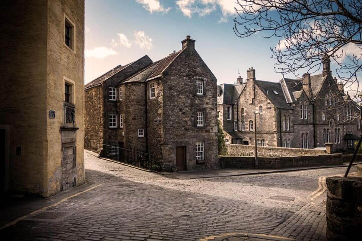 a group of old stone buildings on a street