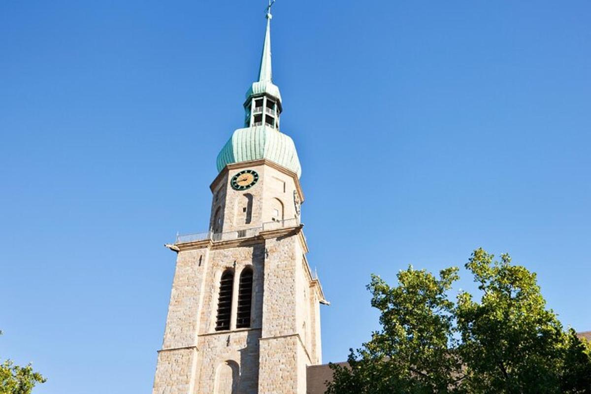a tall tower with a clock on the top of it