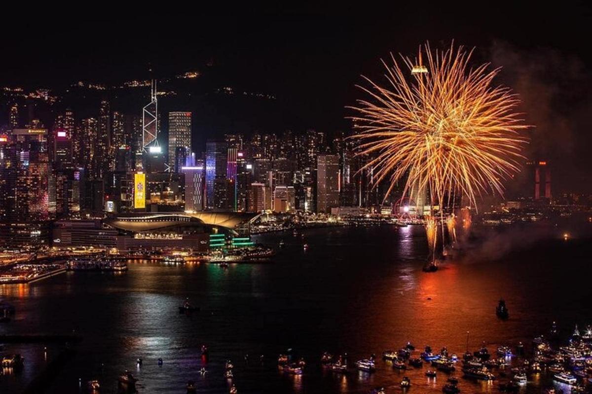 a fireworks display with a city in the background