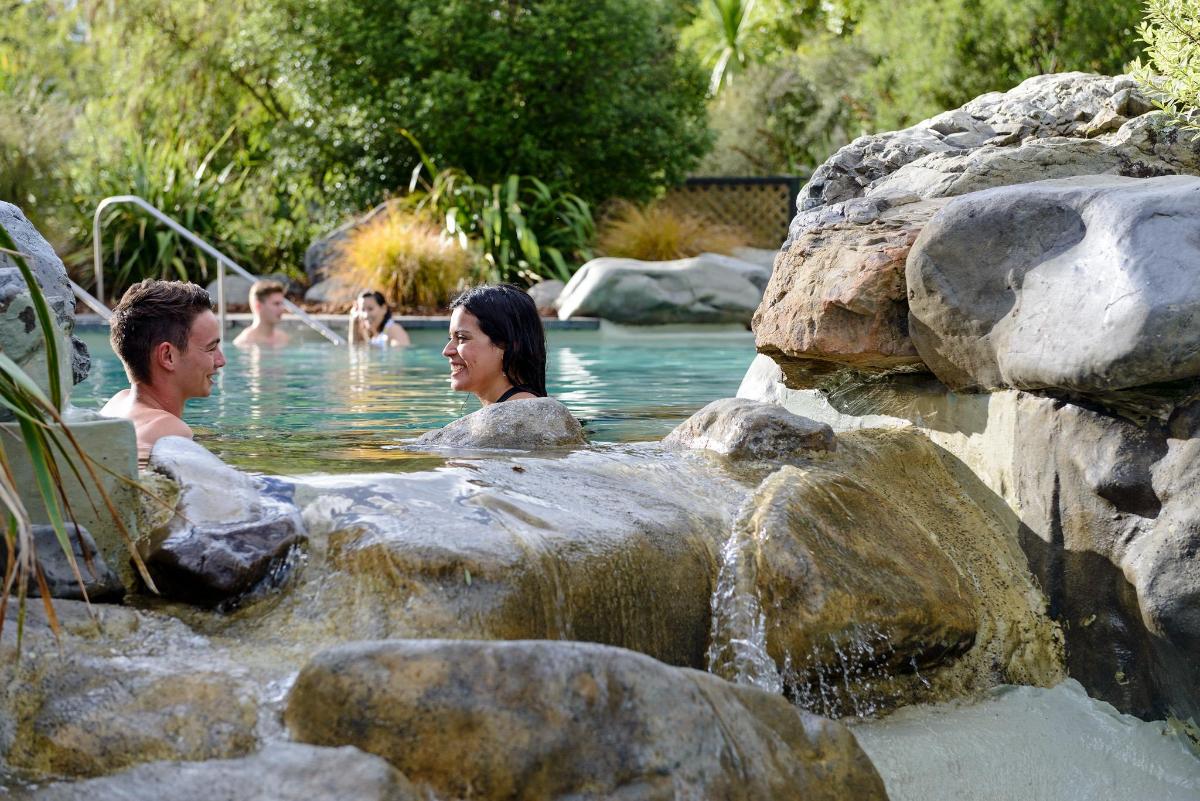 a man and a woman in a pool of water