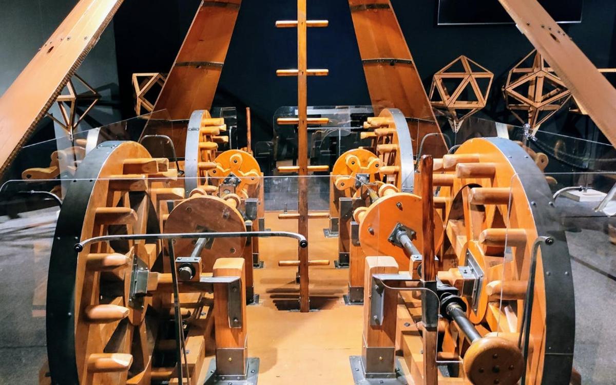 a row of woodworking machines in a room