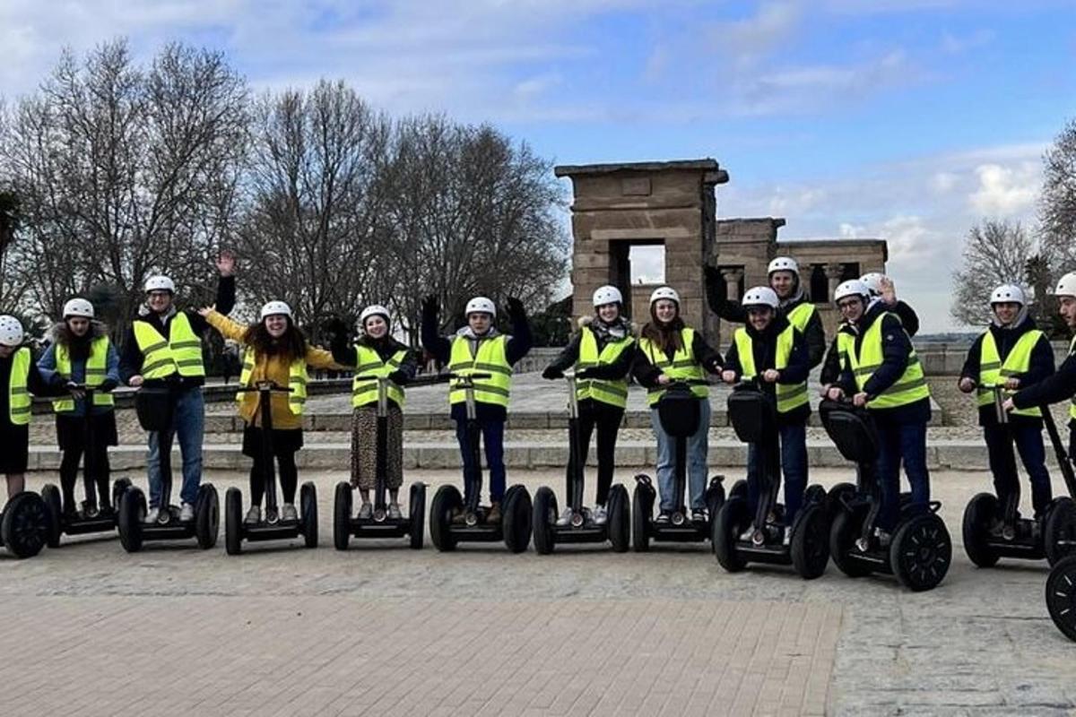 isang grupo ng mga tao na naka-dilaw na vest na nakasakay sa mga segway