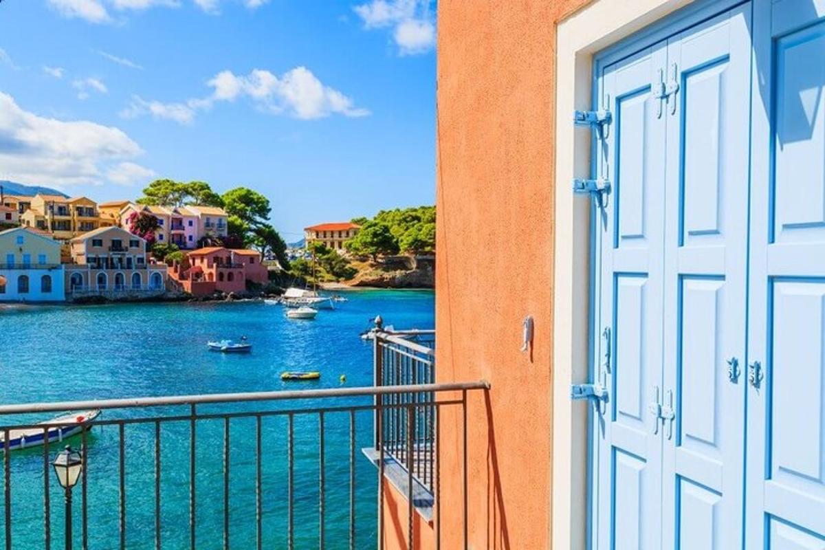 a door to a balcony with a view of a body of water
