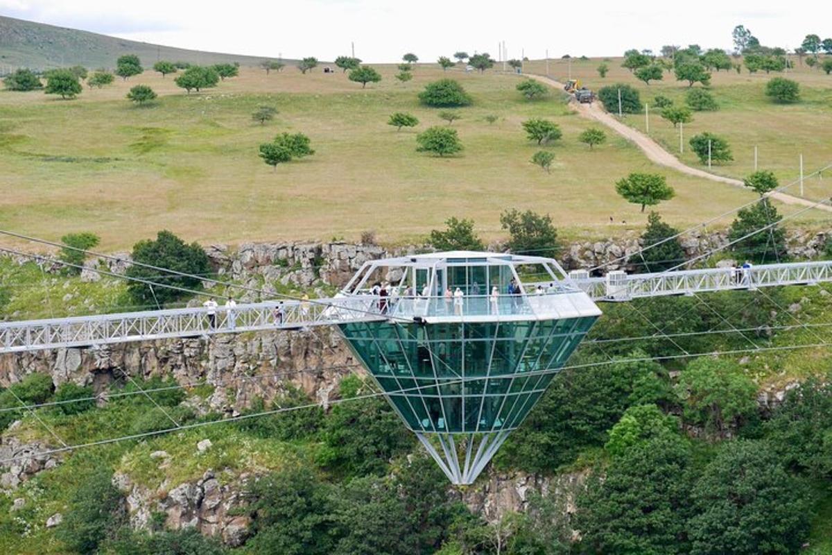 a gondola ride in the sky over a mountain