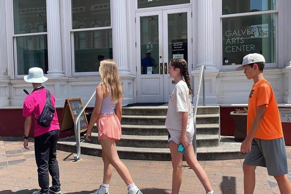 a group of young people walking in front of a building