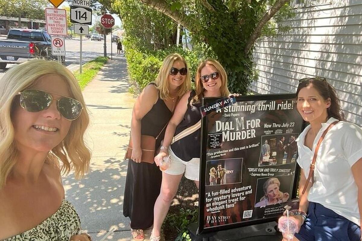 a group of women standing next to a sign
