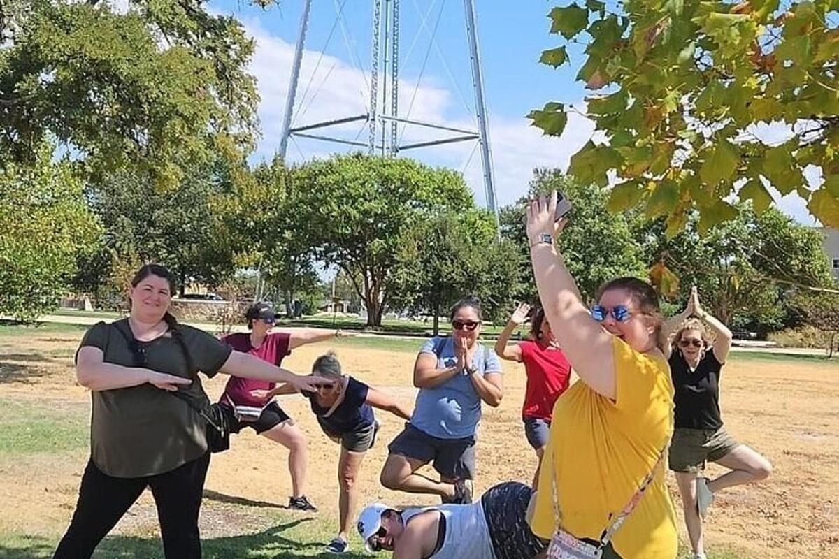 a group of people playing a game of frisbee